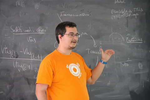 Penyaskito presenting in front of a blackboard full of math formulaes