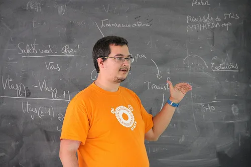 Penyaskito presenting in front of a blackboard full of math formulaes
